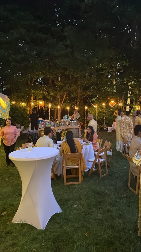 Outdoor evening dining setup with string lights