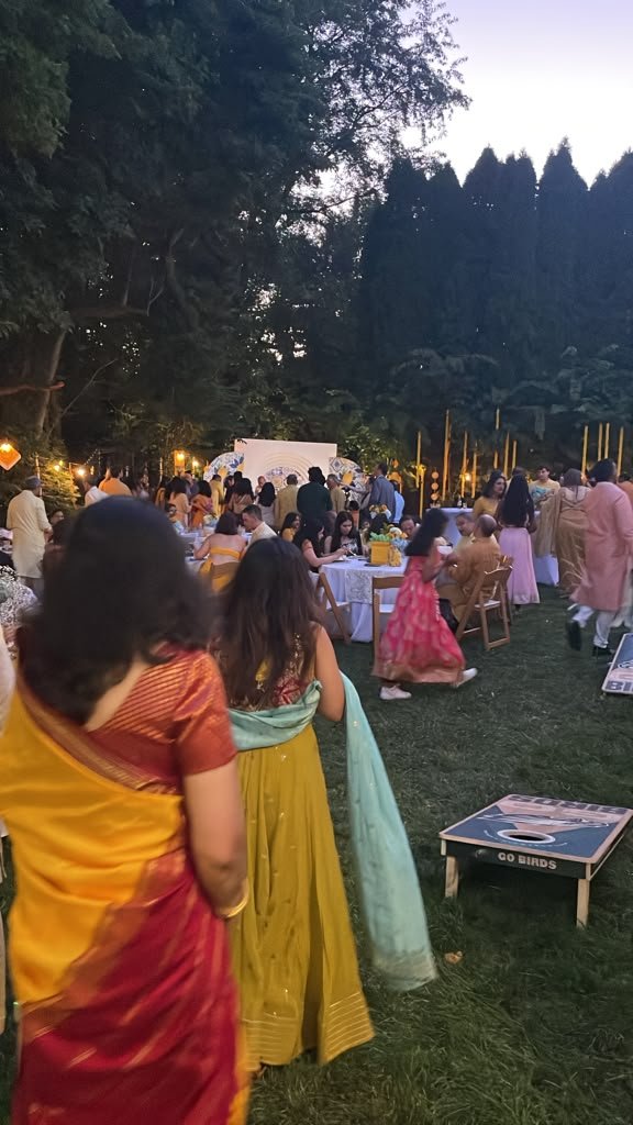 Guests in traditional attire at a catered celebration